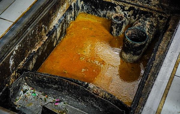 proper grease trap cleaning helps prevent grease and oil from entering the sewer system and polluting waterways